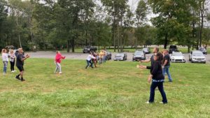 Water balloon toss with employees at the 2021 company picnic